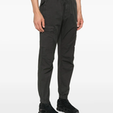 Grey pants worn by a person, showing the pants fit