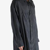 Black shirt worn by a person, showing the shirt's fit