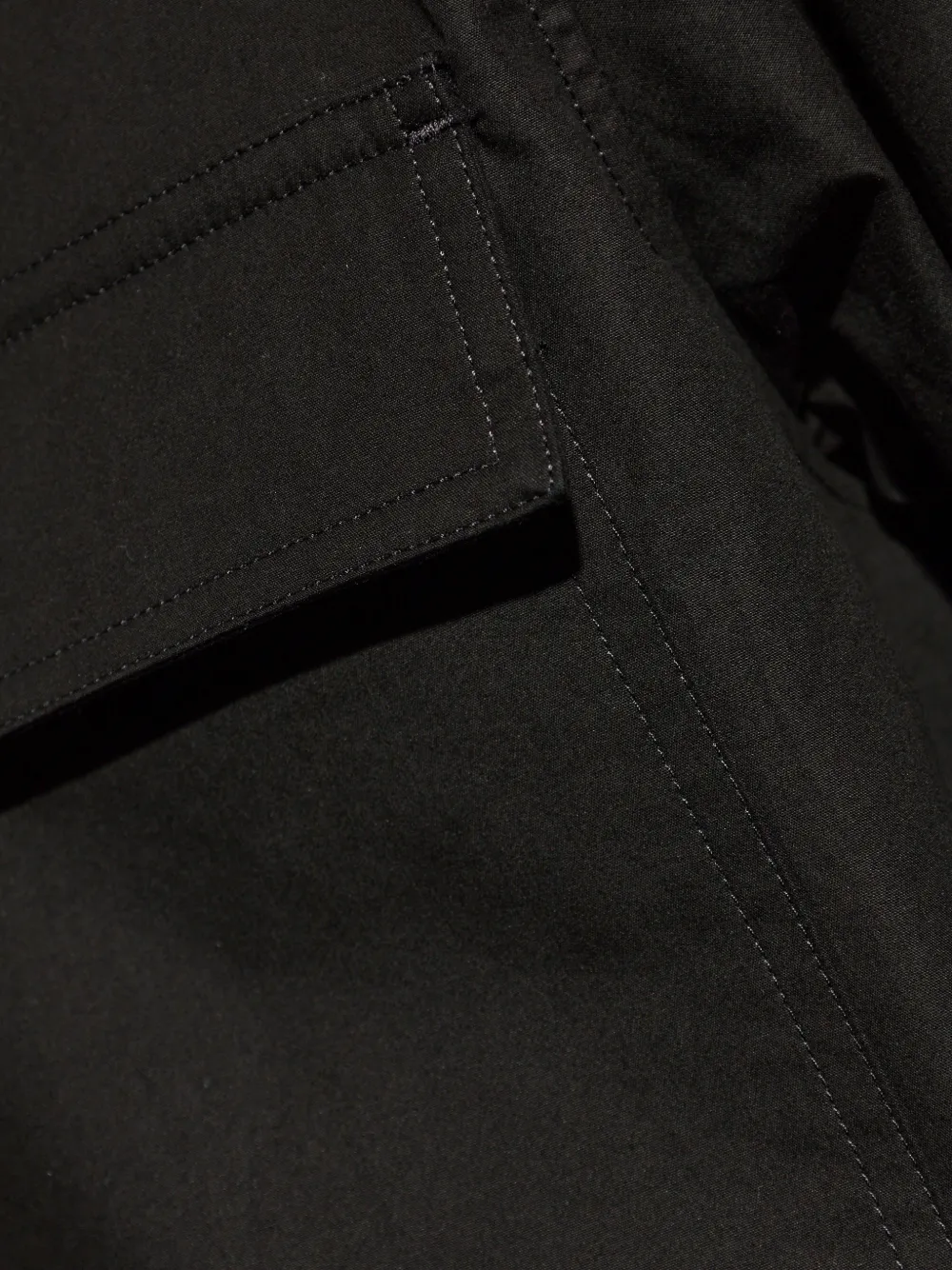 Close up of Black shirt, showing texture of the 100% cotton fabric