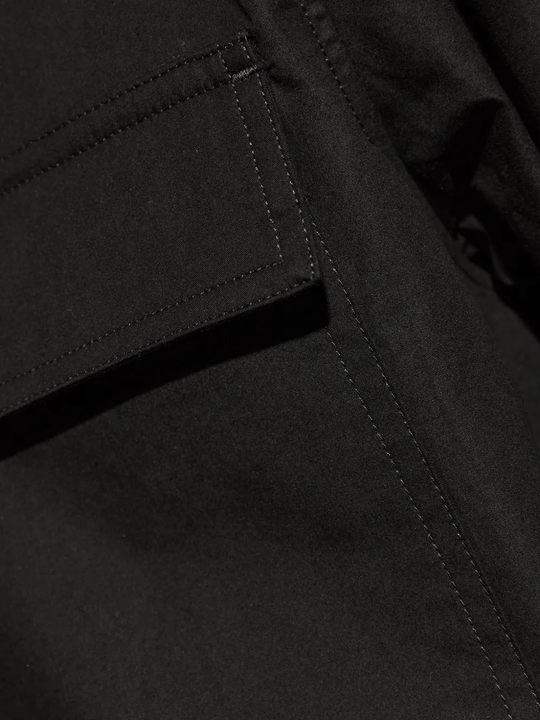 Close up of Black shirt, showing texture of the 100% cotton fabric