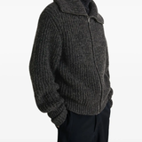 Black cardigan worn by a person, showing the cardigans  fit