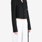 Black jacket worn by a person, showing the jacket fit