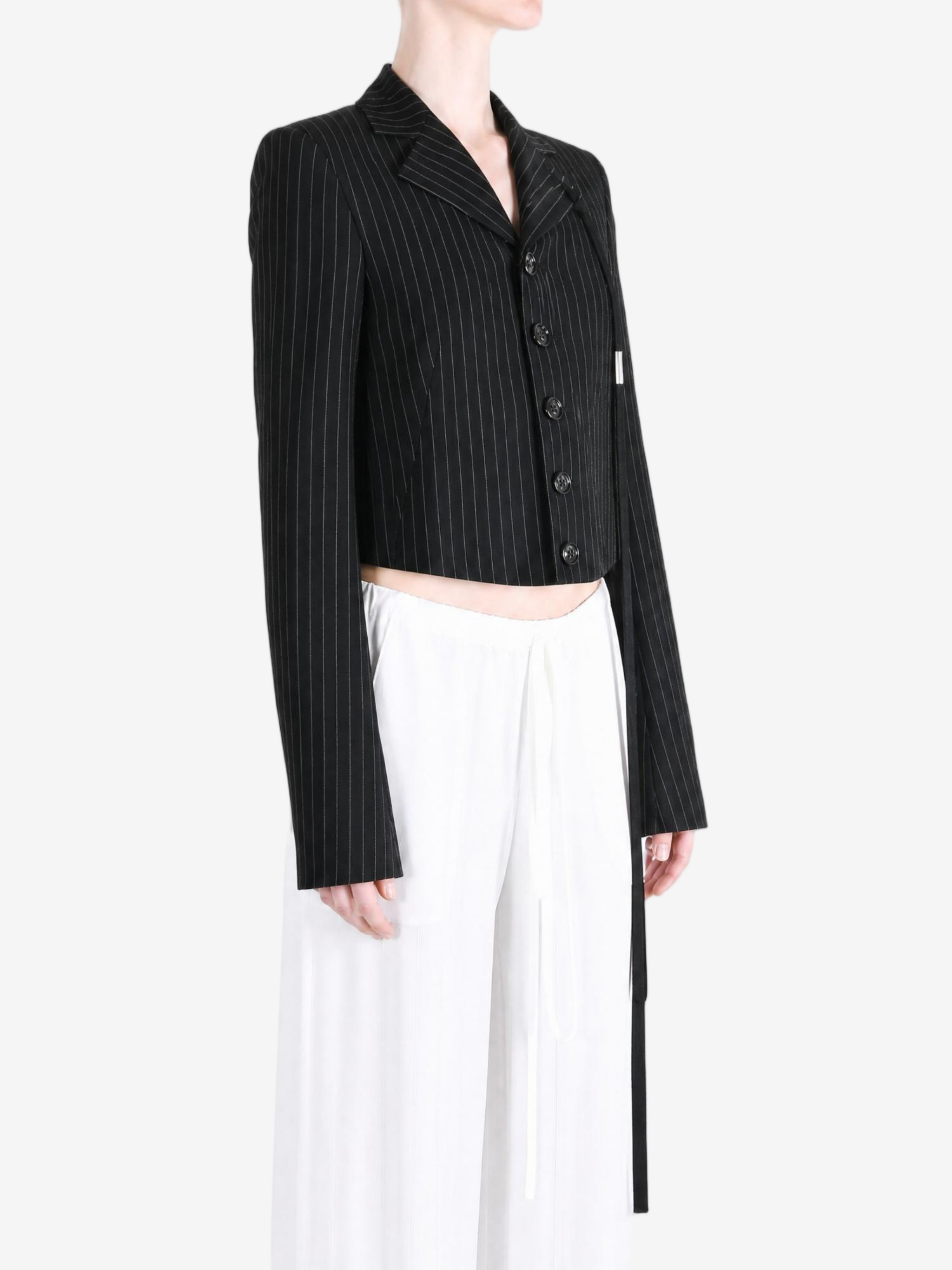 Black jacket worn by a person, showing the jacket fit