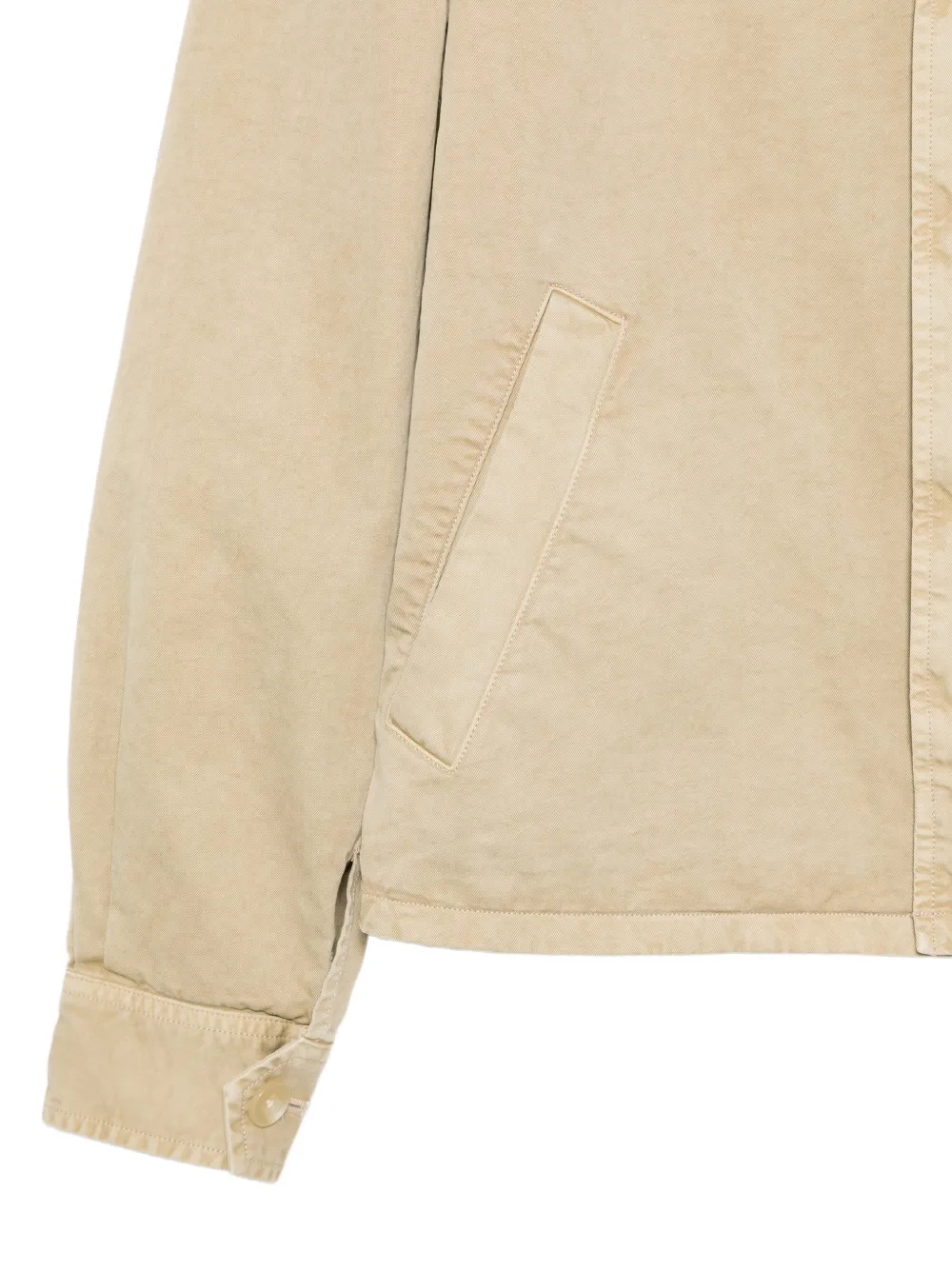 Close up of tan jacket, showing texture of the cotton fabric