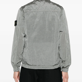 Grey coat worn by a person, showing the coat's fit