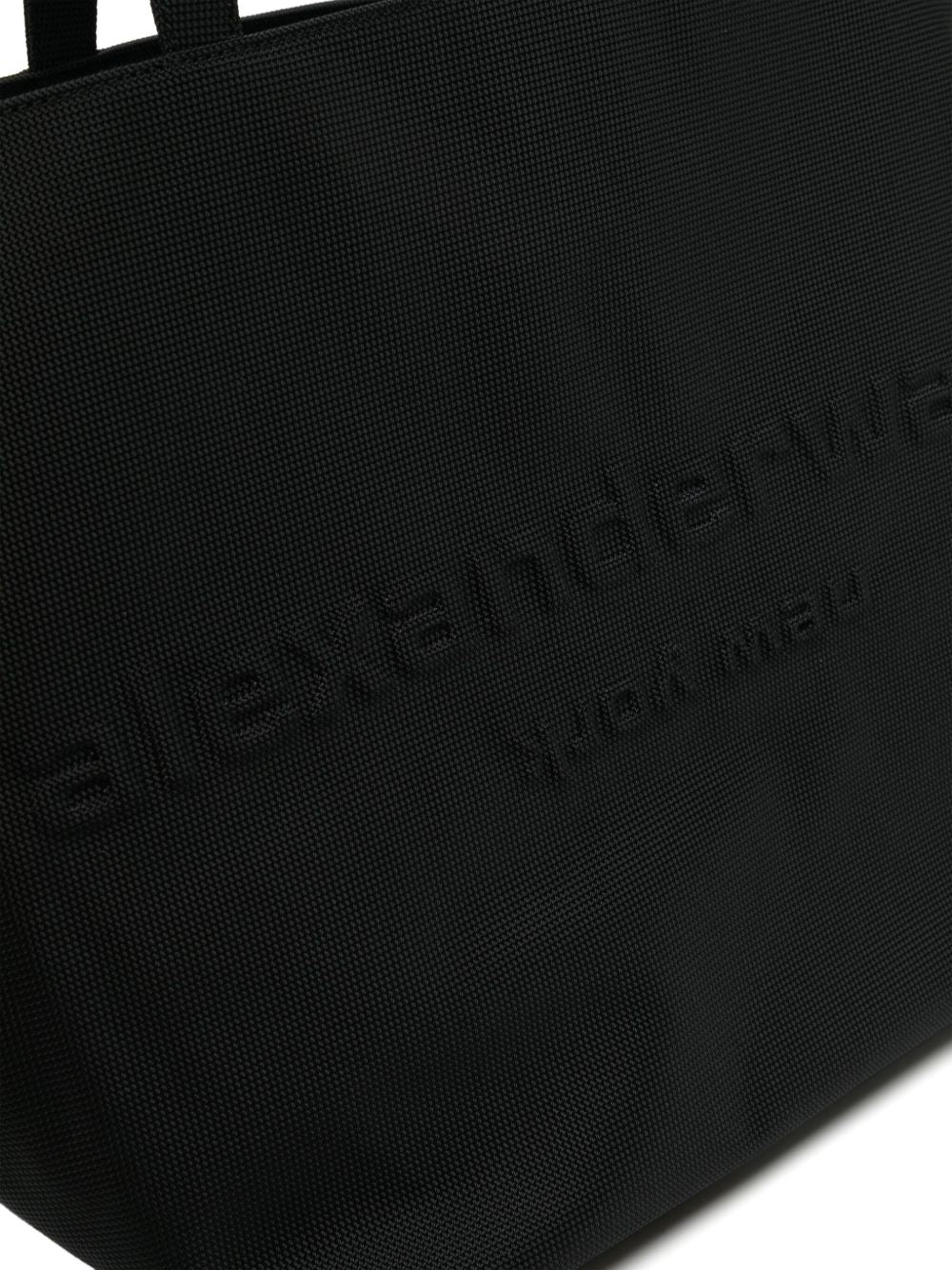 Close up of black bag, showing texture of the nylon fabric