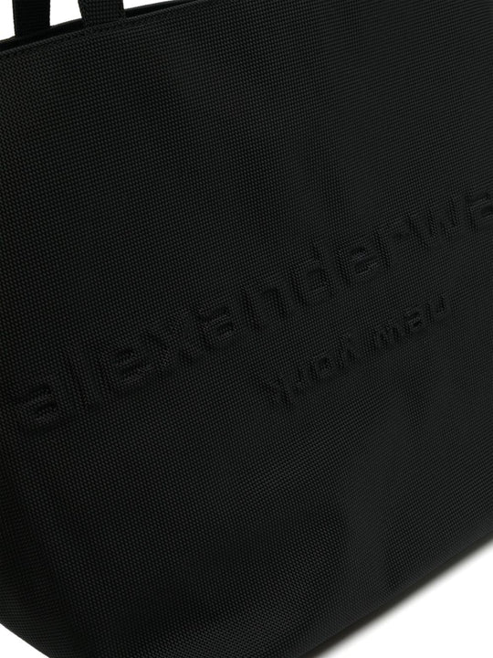 Close up of black bag, showing texture of the nylon fabric
