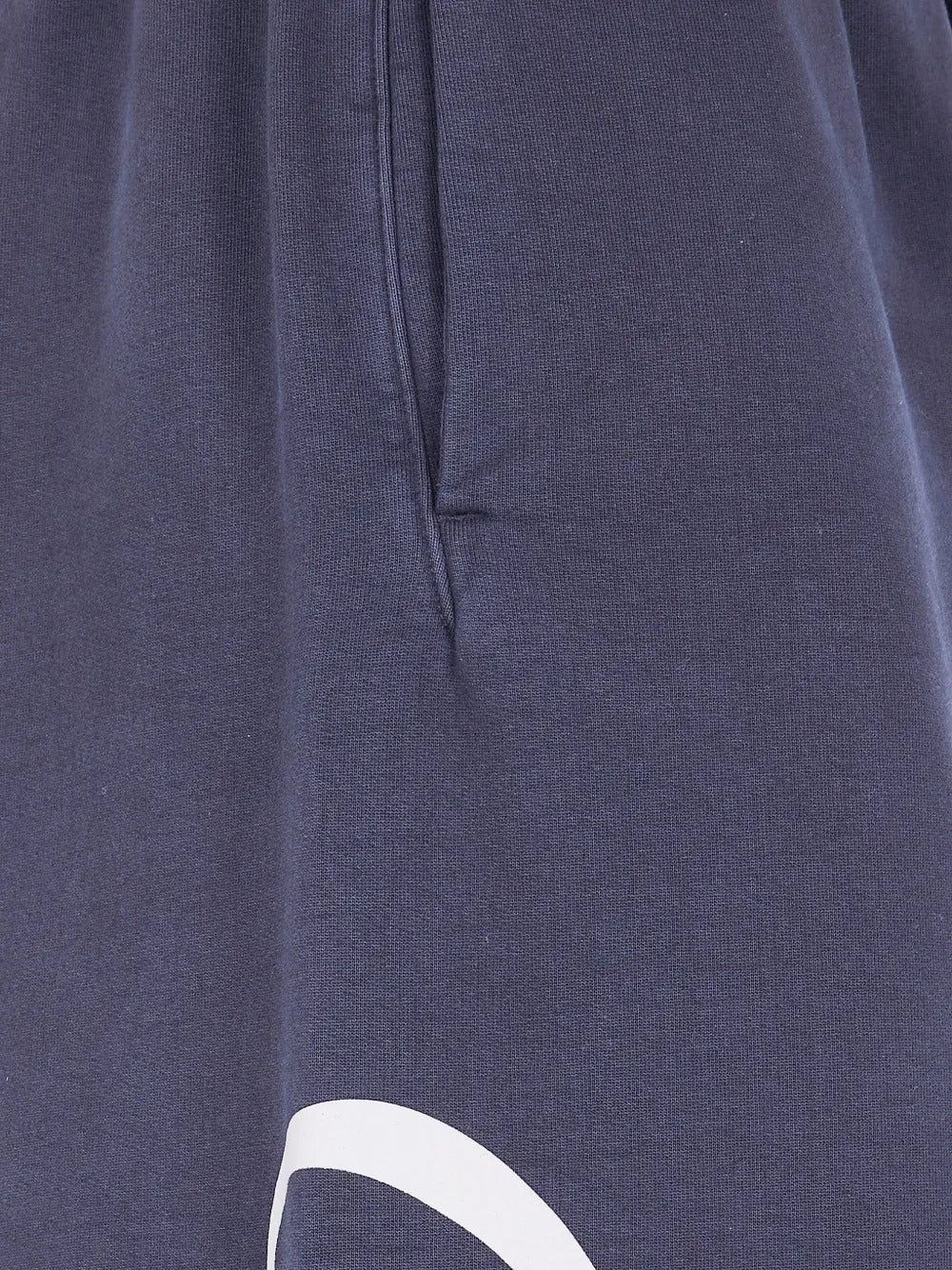 Close up of blue pants, showing texture of the cotton fabric