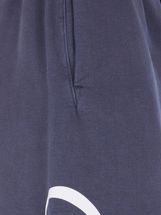 Close up of blue pants, showing texture of the cotton fabric