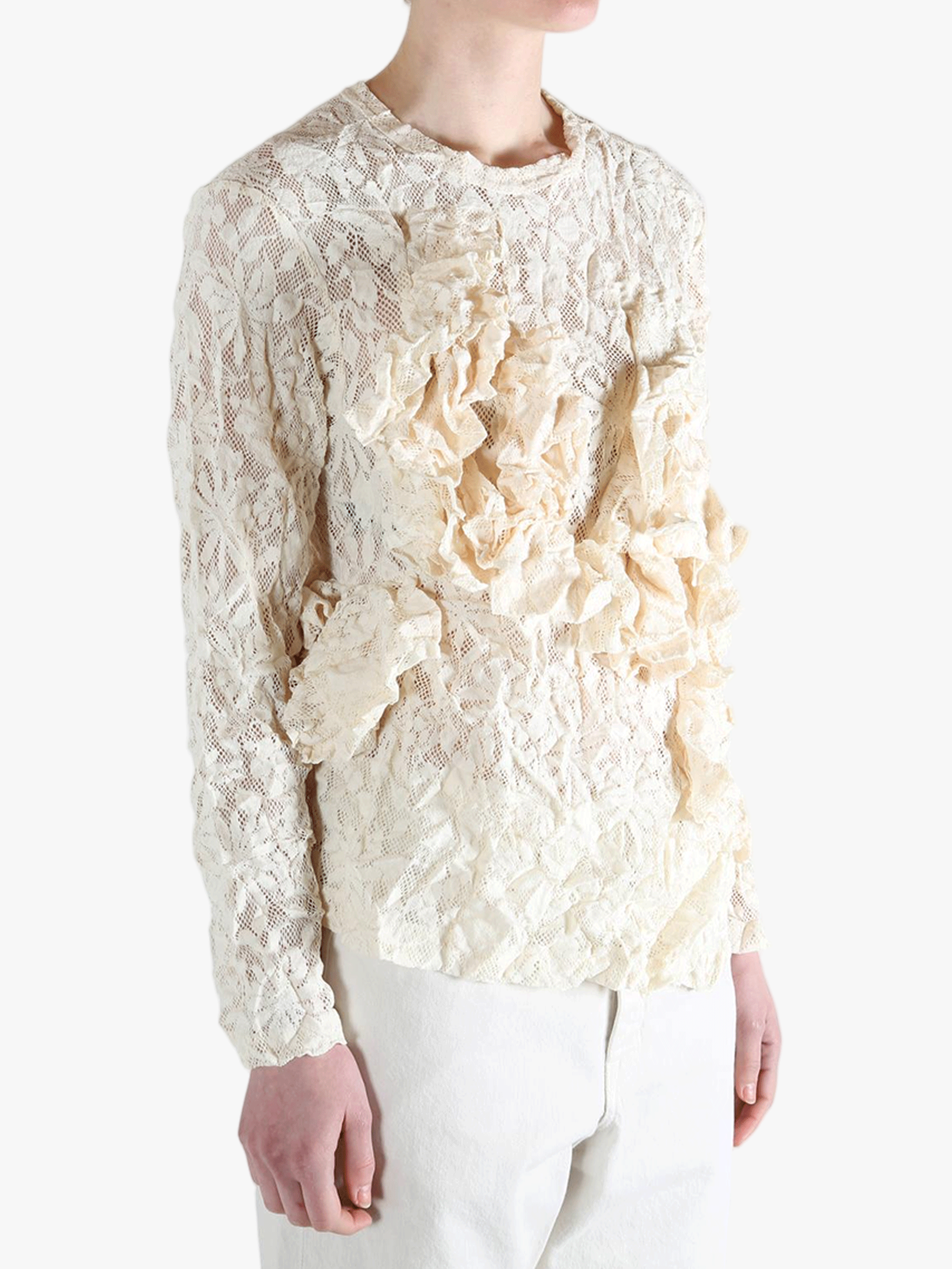 White shirt worn by a person, showing the shirt's fit