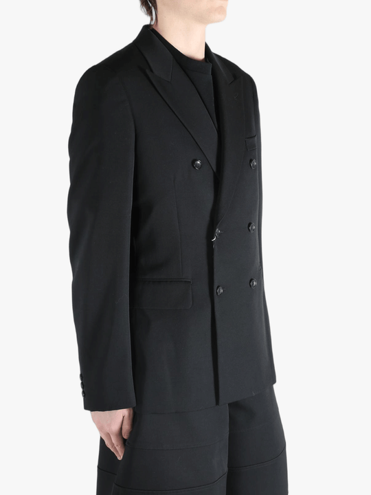 Black jackets worn by a person, showing the jackets fit