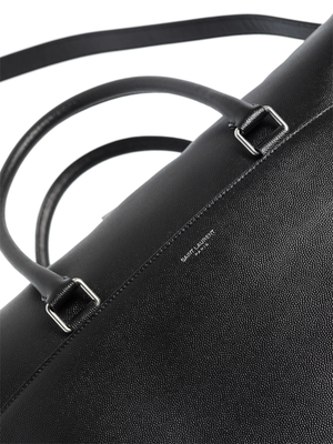 Close up of black bag, showing texture of the leather fabric