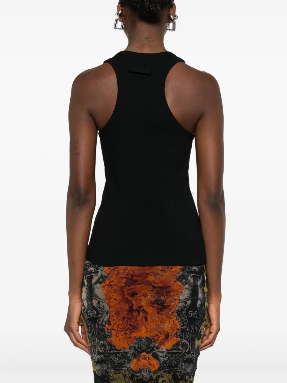 Black top worn by a person, showing the top's fit