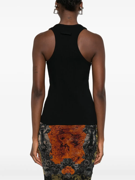 Black top worn by a person, showing the top's fit