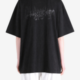 Black t-shirt worn by a person, showing the t-shirt fit