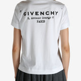 White t-shirt worn by a person, showing the shirt's fit