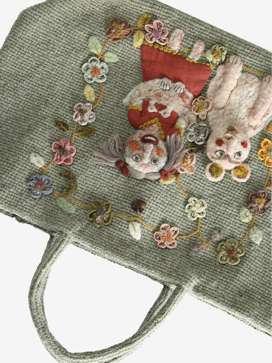 Close up of green bag,showing texture of the wool fabric