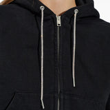 Close up of black hoodie, showing texture of the cotton fabric