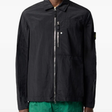 Black jacket worn by a person, showing the black jacket's fit