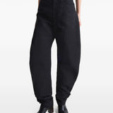 Black pant worn by a person, showing the pant’s fit