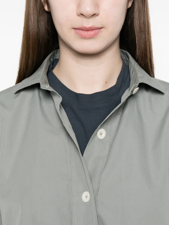 Close up of gray button-up shirt,showing texture of the cotton fabric
