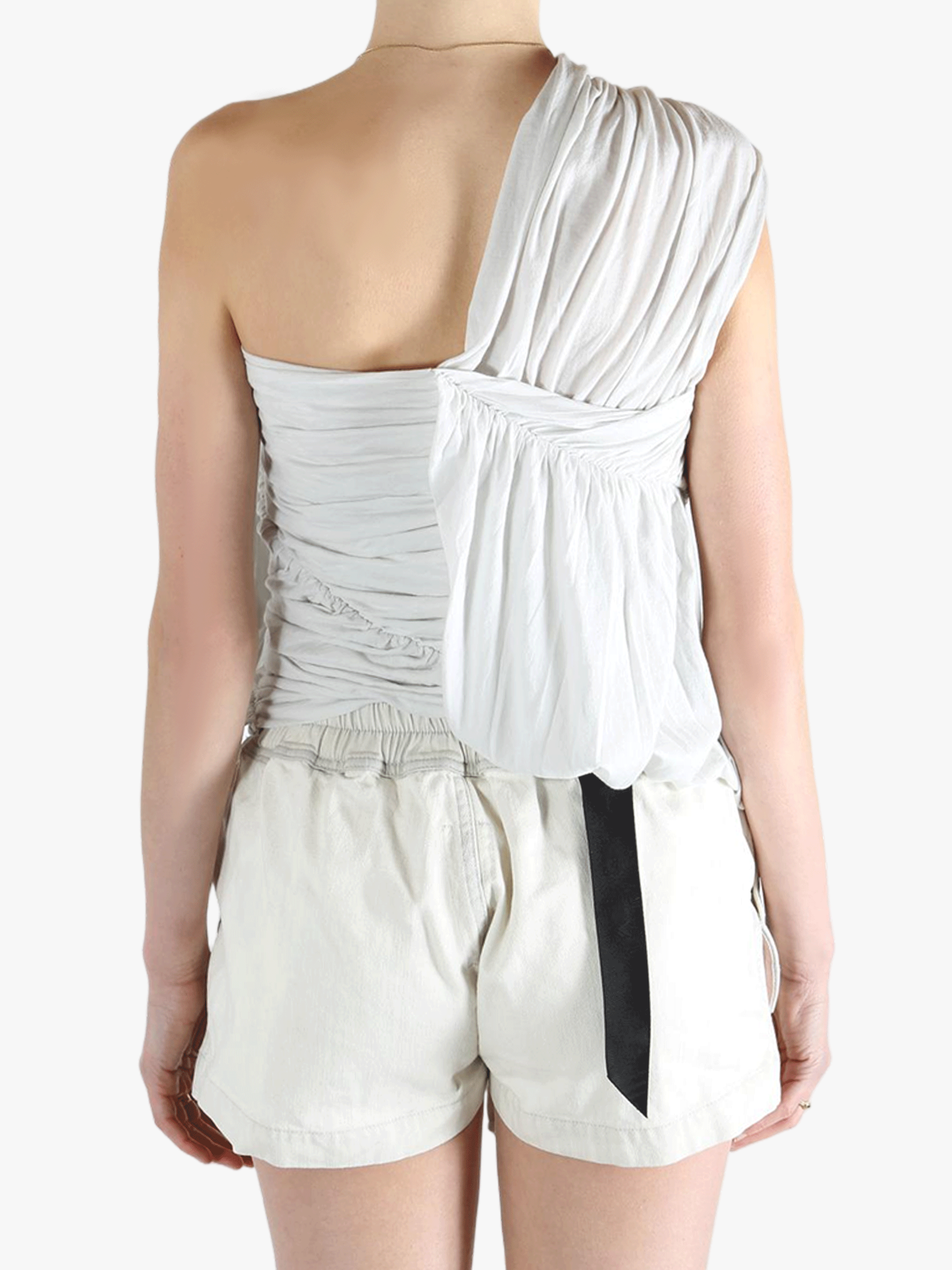 White tops worn by a person, showing the tops fit