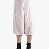 Pink pants worn by a person, showing the pants fit