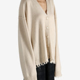 Tan knitwear worn by a person, showing the knitwear fit