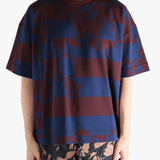 Blue t-shirt worn by a person, showing the t-shirt fit