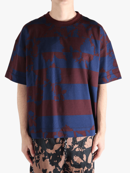 Blue t-shirt worn by a person, showing the t-shirt fit