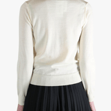 White jacket worn by a person, showing the jacket's fit