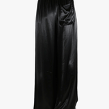 Black pants worn by a person, showing the pant's fit