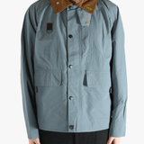 Blue jacket worn by a person, showing the jacket fit