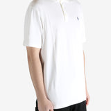White t-shirt worn by a person, showing the shirt's fit