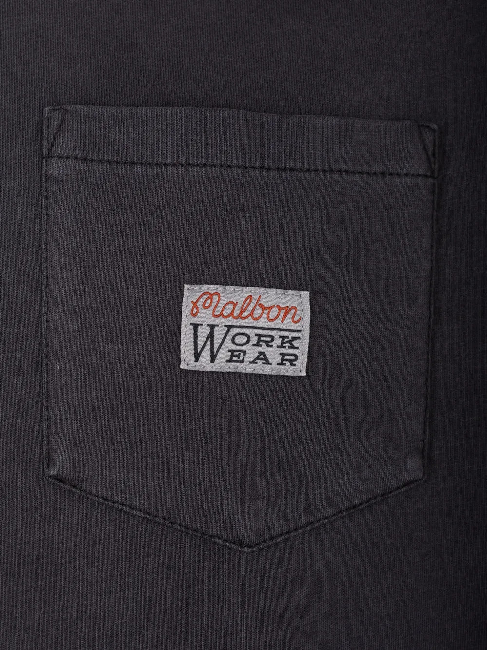 Close up of Black t-shirt, showing texture of the 100% cotton fabric