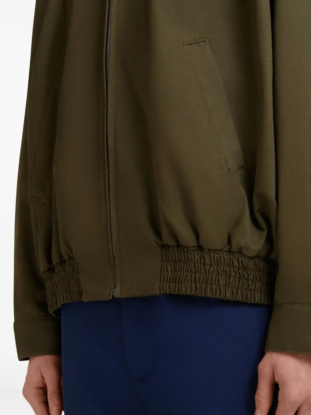 Close up of brown jacket, showing texture of the cotton blend fabric