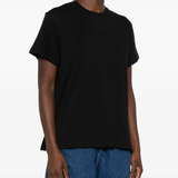Black t-shirt worn by a person, showing the shirt fit