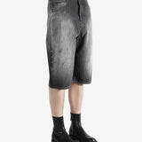 Black shorts worn by a person, showing the shorts's fit