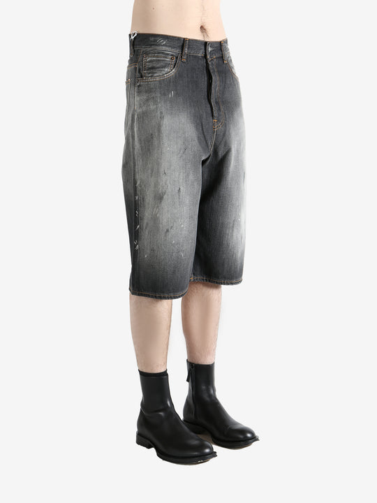 Black shorts worn by a person, showing the shorts's fit