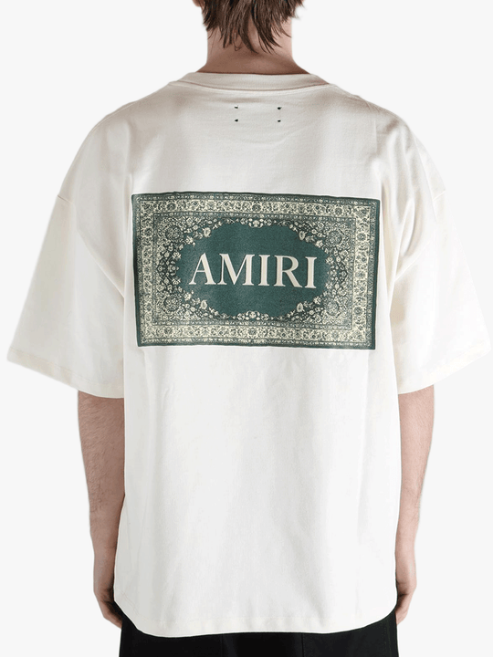 White t-shirt worn by a person, showing the t-shirt's fit