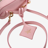 Close up of pink bag, showing texture of the Organic Leather fabric