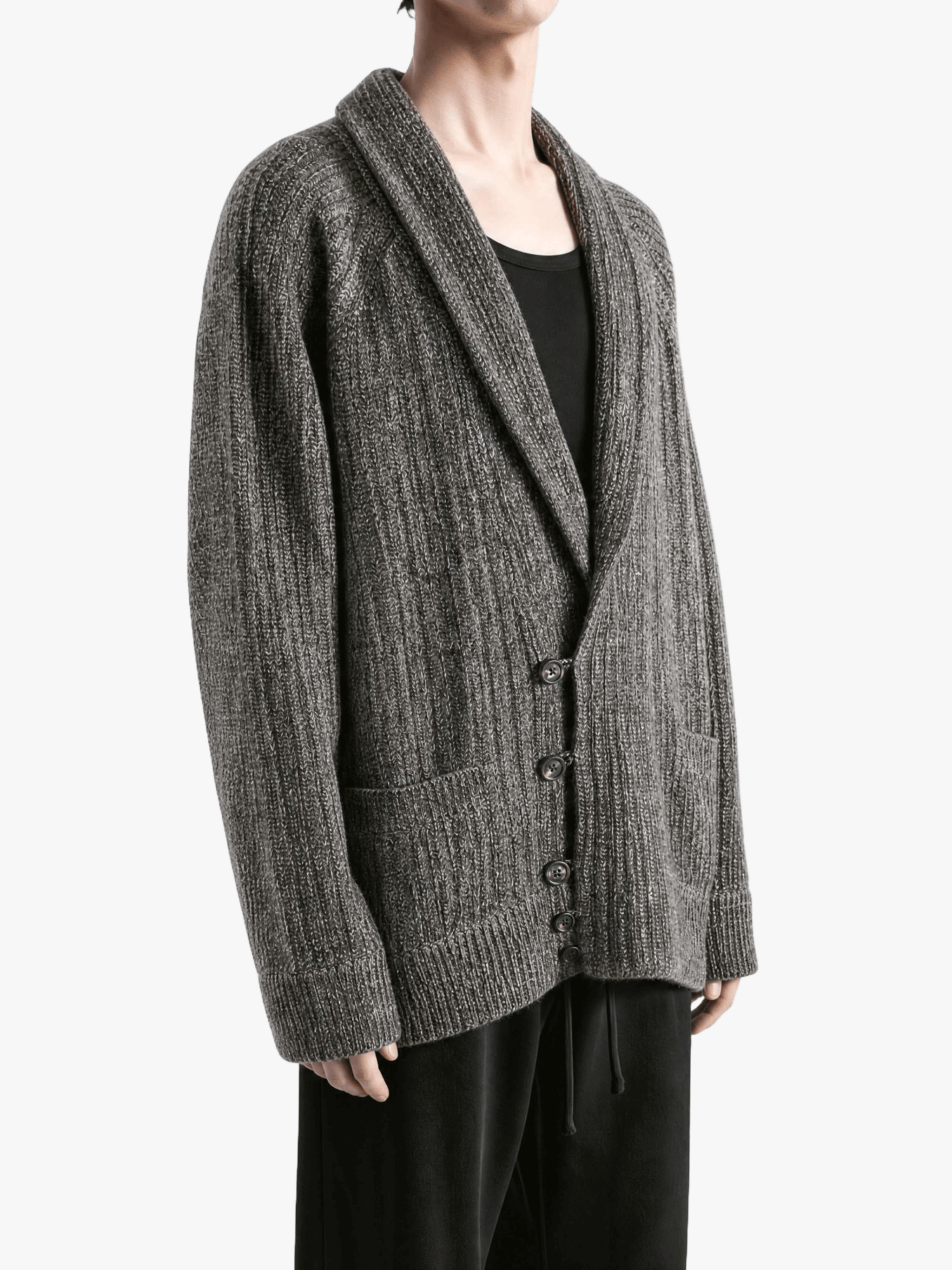 Grey knitwear worn by a person, showing the knitwear fit
