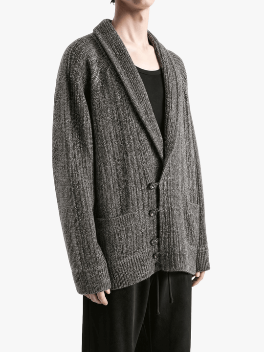 Grey knitwear worn by a person, showing the knitwear fit