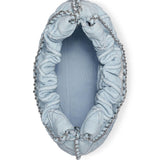 Close up of blue bag, showing texture of the napa leather and cotton fabric