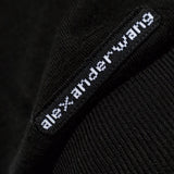 Close up of Black knitwear, showing texture of the 100% wool fabric