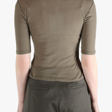 Brown t-shirt worn by a person, showing the t-shirt's fit