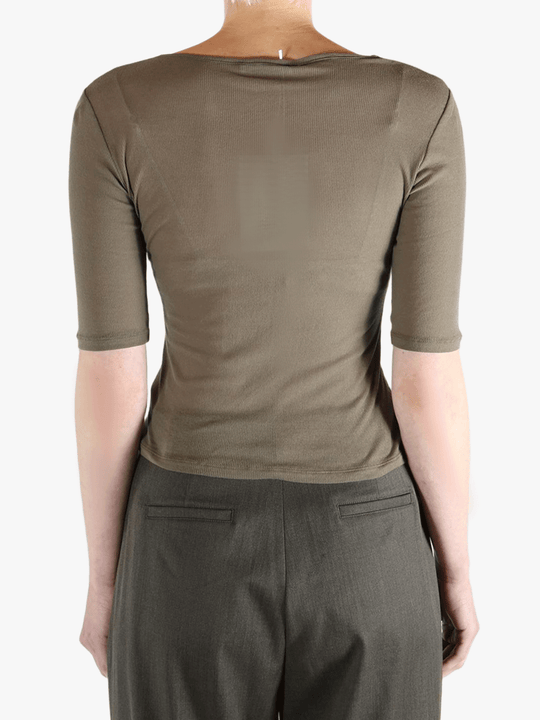 Brown t-shirt worn by a person, showing the t-shirt's fit