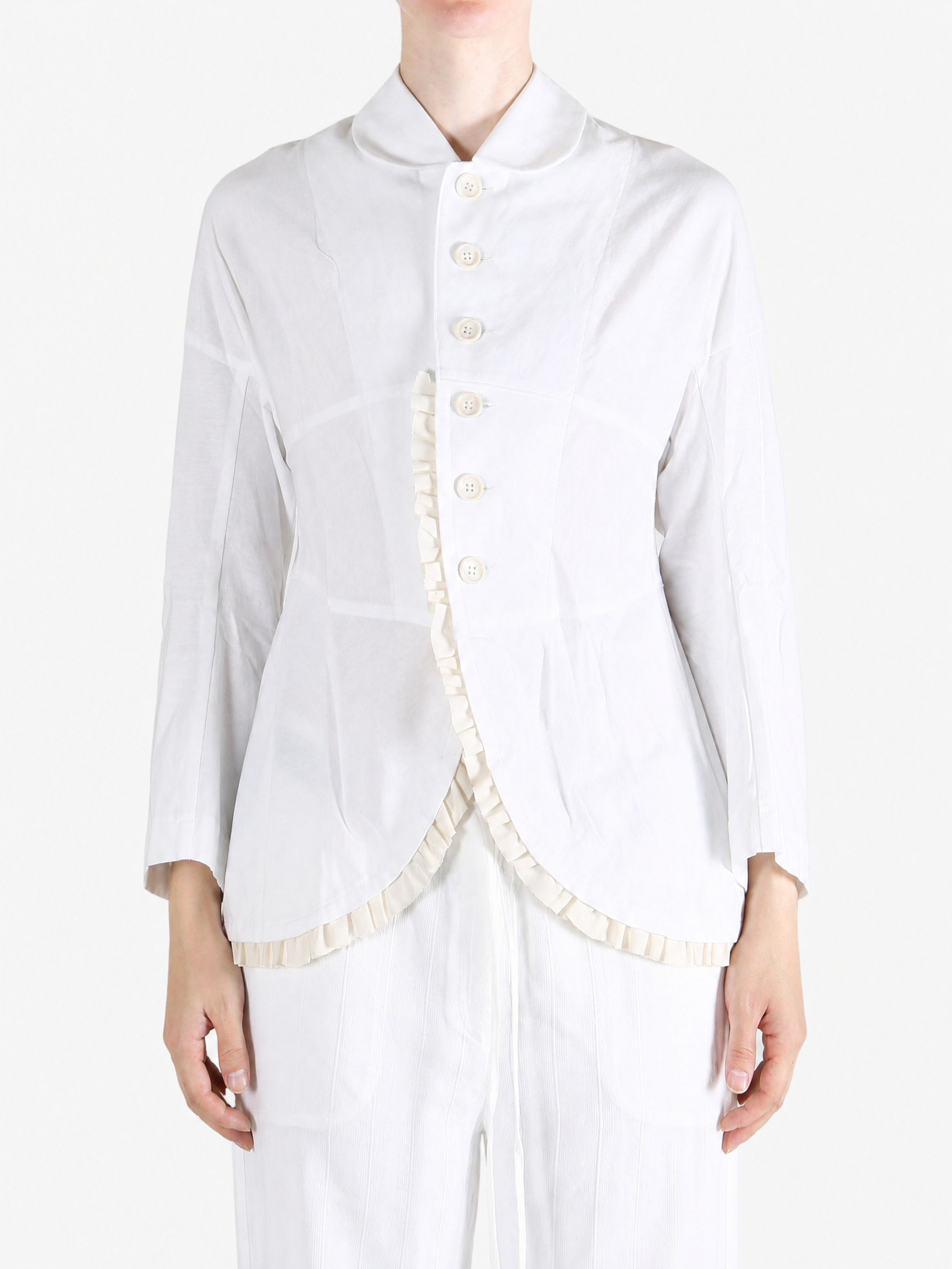 White jacket worn by a person, showing the jacket fit