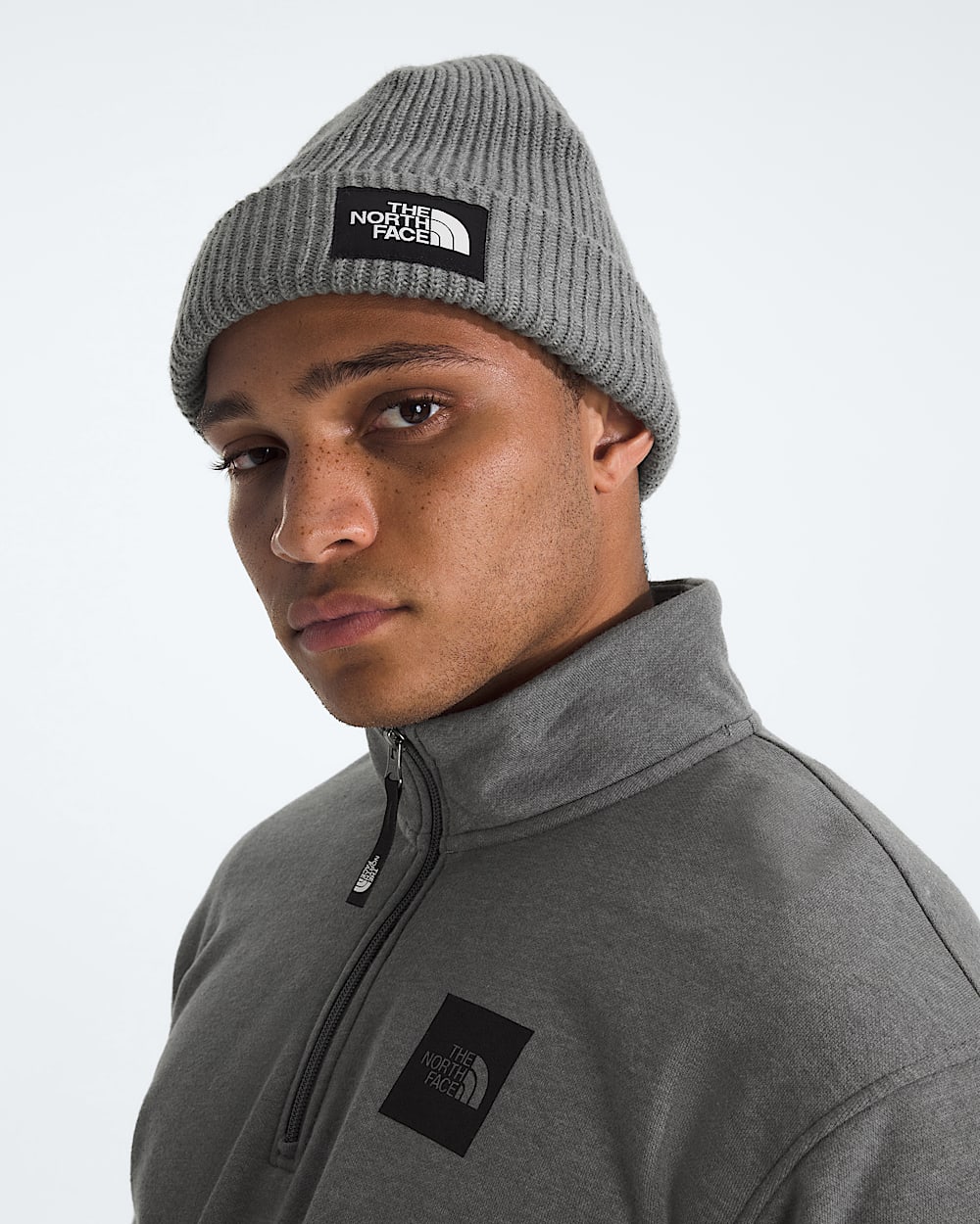 Grey hat worn by a person, showing the hat fit
