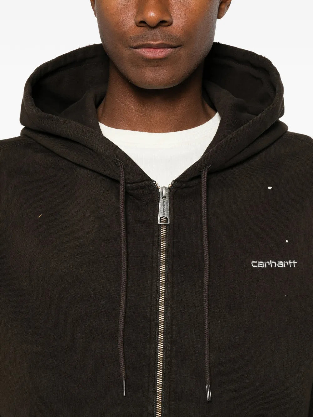 Black jacket worn by a person, showing the jacket fit